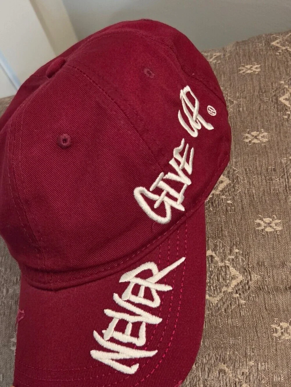 Maroon Baseball Cap with 'Never Give Up' Embroidery